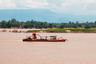 Mekong River with sand boats and fishermen Laos