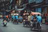Richshaw ride through old quarter Hanoi Vietnam